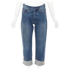 DIOR CD 01 : jean boyfriend court en denim bleu avec bandeau logo et ourlets effilochés, taille 36 S