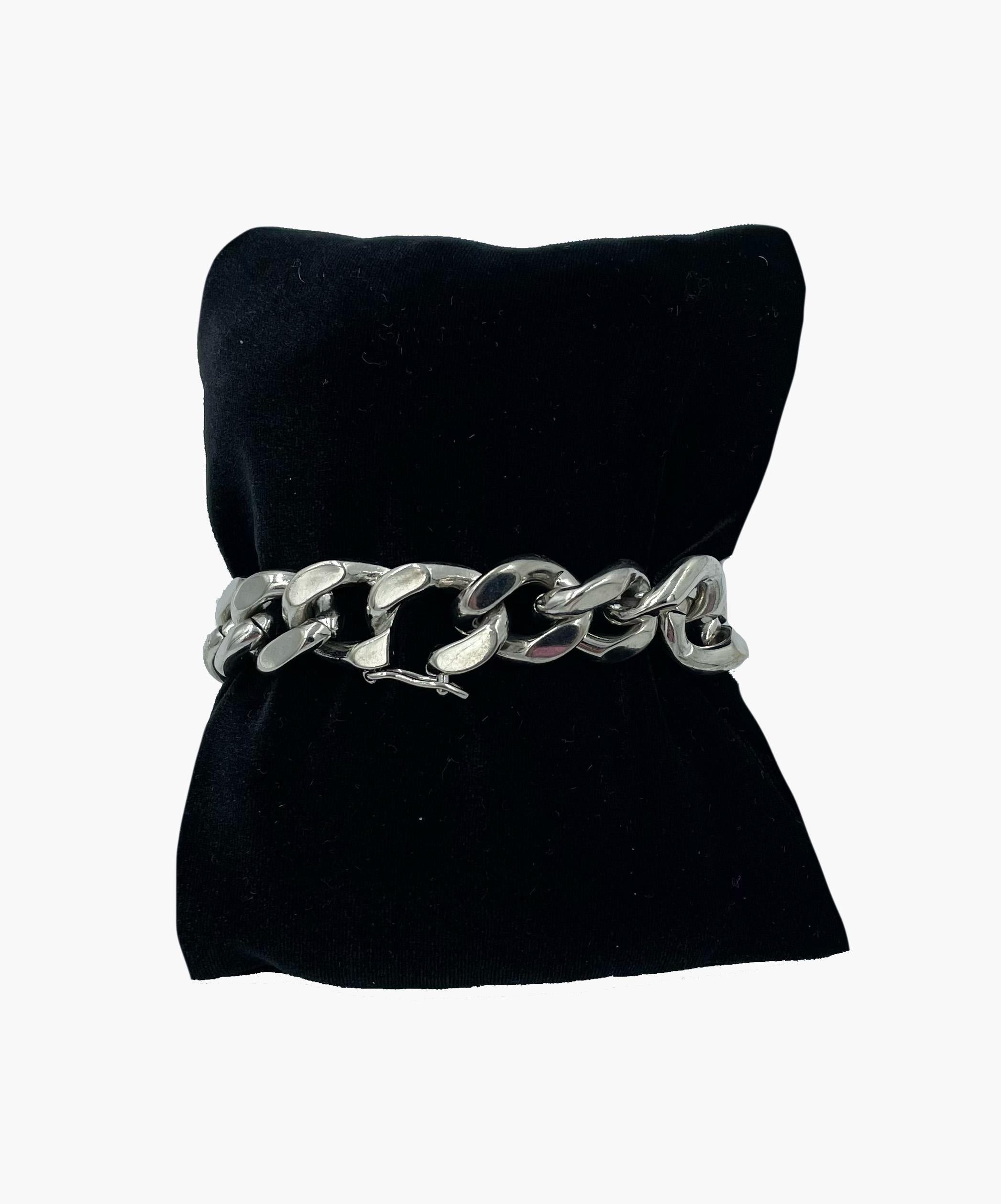 Iconic chain style massive Dior bracelet in silver tone with DIOR logo plaque and lipgloss inside. Gourmette collection. 
Period: 2000s 
Total length: 20cm 
Condition: very good. Light scratches throughout metal. Lipgloss is used. Please see
