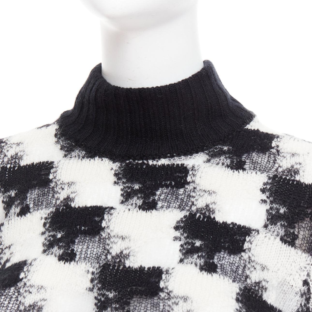 DIOR ChecknDior black white cashmere check sheer turtleneck sweater FR34 XS
Reference: AAWC/A01372
Brand: Dior
Designer: Maria Grazia Chiuri
Collection: ChecknDior
Material: Cashmere, Blend
Color: Black, White
Pattern: Checkered
Closure: