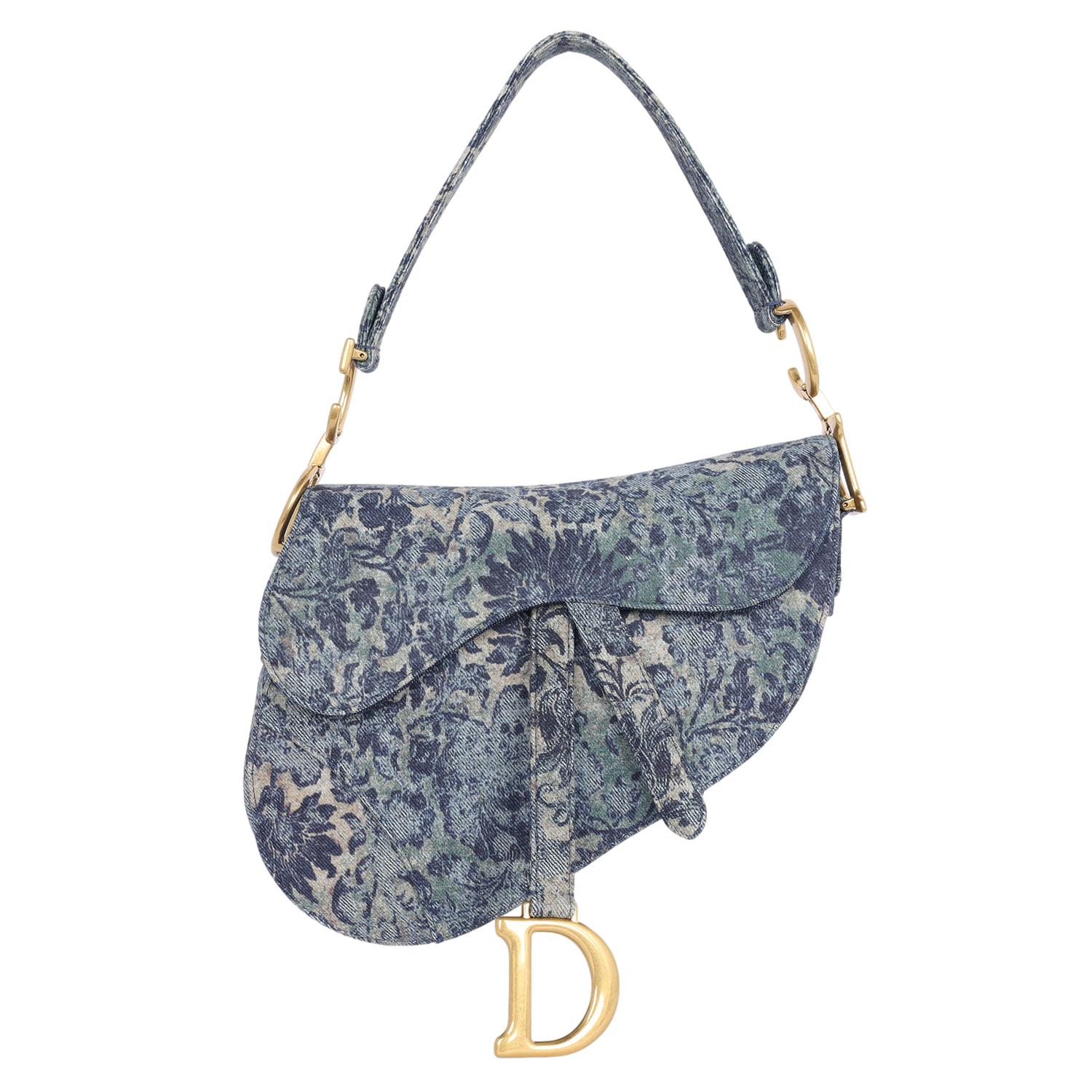 Authentic Like New Christian Dior medium Floral Denim Saddle Bag. 

Christian Dior Shoulder Bag
From the 2022 Collection by Maria Grazia Chiuri
Blue Canvas
Printed
Gold-Tone Hardware
Leather Trim
Flat Handle & Single Shoulder Strap
Leather Trim