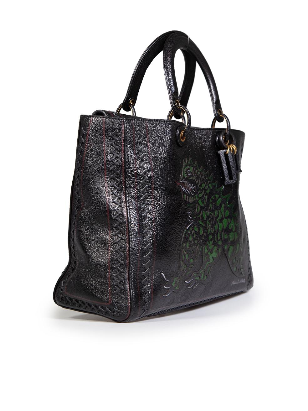 CONDITION is Very good. Minimal wear to the bag is evident, the leather is slightly peeling on the hardware rings that join the handle to the main body of the bag. The suede lining under the top flap of the bag has discolouration and the hardware