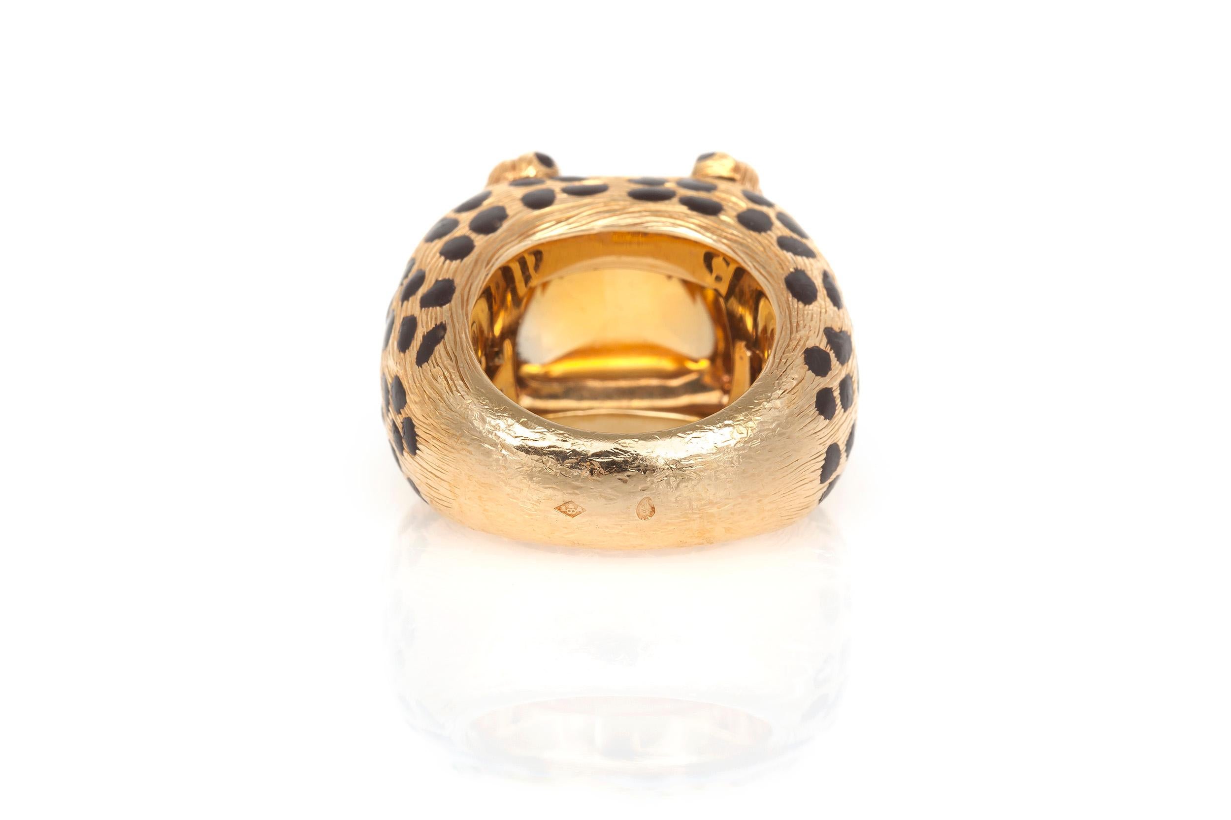 Christian Dior Ring crafted in 18K yellow gold decorated by black enamel leopard spots. At the center one square-shaped sugarloaf cabochon citrine is quartered by clasping leopard paws.