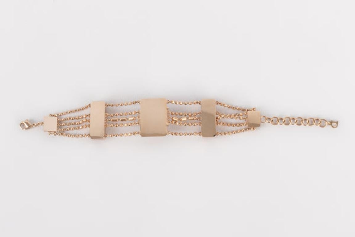 Dior - (Made in France) Copper metal bracelet with rhinestones. Jewelry from the 2000s.

Additional information: 
Condition: Very good condition
Dimensions: Length: from 15 cm to 19 cm
Period: 21st Century

Seller Reference: BRA40