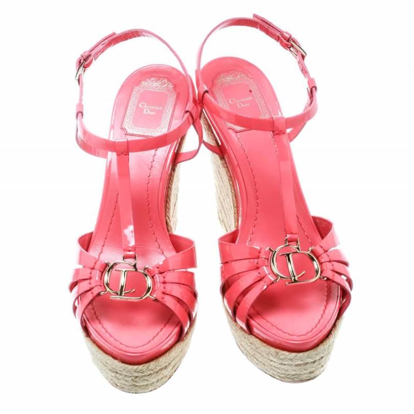 These Dior sandals are made from the finest quality leather which makes them durable and long lasting. These fashionable shoes feature a T-strap design, the CD logo on the uppers, ankle straps and espadrille wedges. Wear this pink pair to the next