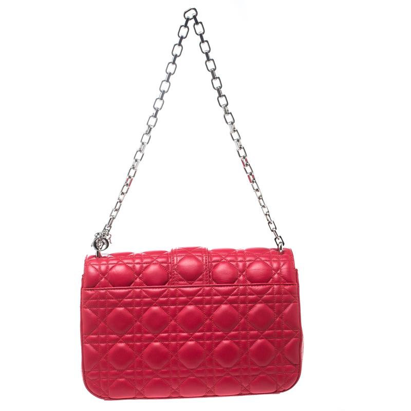 Flap bags like this Miss Dior will never go out of style. Crafted from leather, this Dior flap bag features a red Cannage exterior and a chain strap. The front flap has a Dior lock that opens to a leather-lined interior with enough space to keep