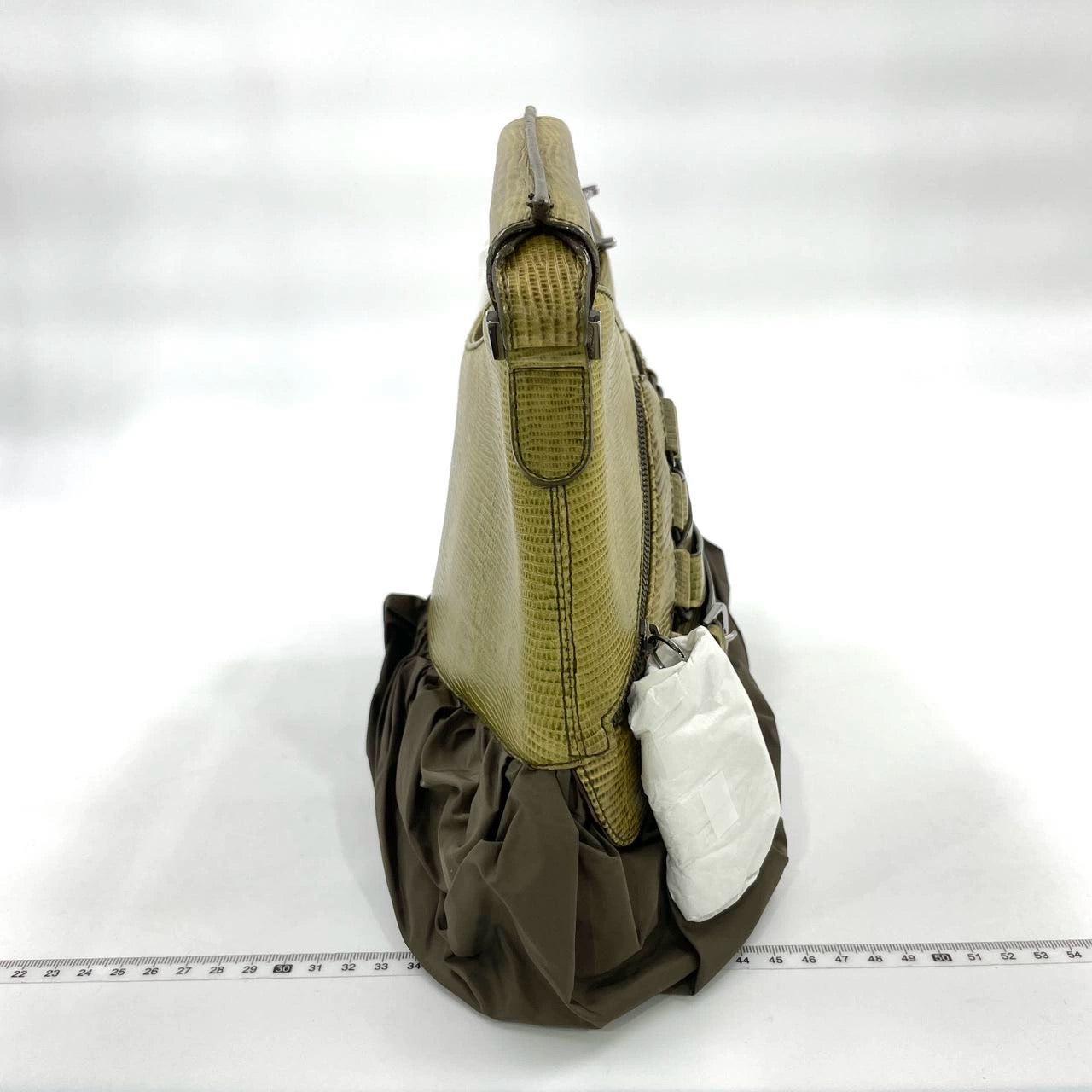 Dior Corset Dark Green Lizard-skin Leather and Satin Lace-up Ballet Bag
 These are professional photos of the actual bag offered by Luxbags.
 
 
  This romantic corset inspired Dior handbag features ballerina style Green Satin Lace-up front, is