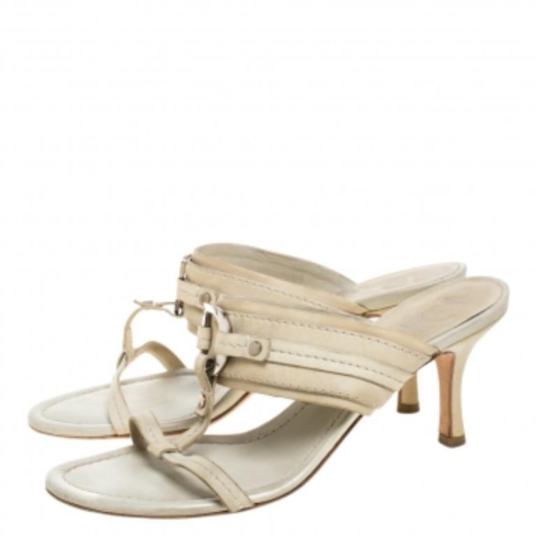 This impressive pair of leather sandals are a wonderful style statement. This footwear comes with the finest quality leather and is durable. This pair from Dior feature open toes and CD charms. Keep it light and casual in this pair designed
