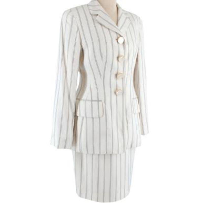 Dior Striped Single Breasted Balzer

-Vertical striped body 
-Fully Lined 
-Mother of pearl button fastening 
-Flap faux pocket 
-Padded shoulders  

Skirt:

-Zip fastening along the side 
-Fully lined 
-Vertical striped 

Material: 

100% Viscose