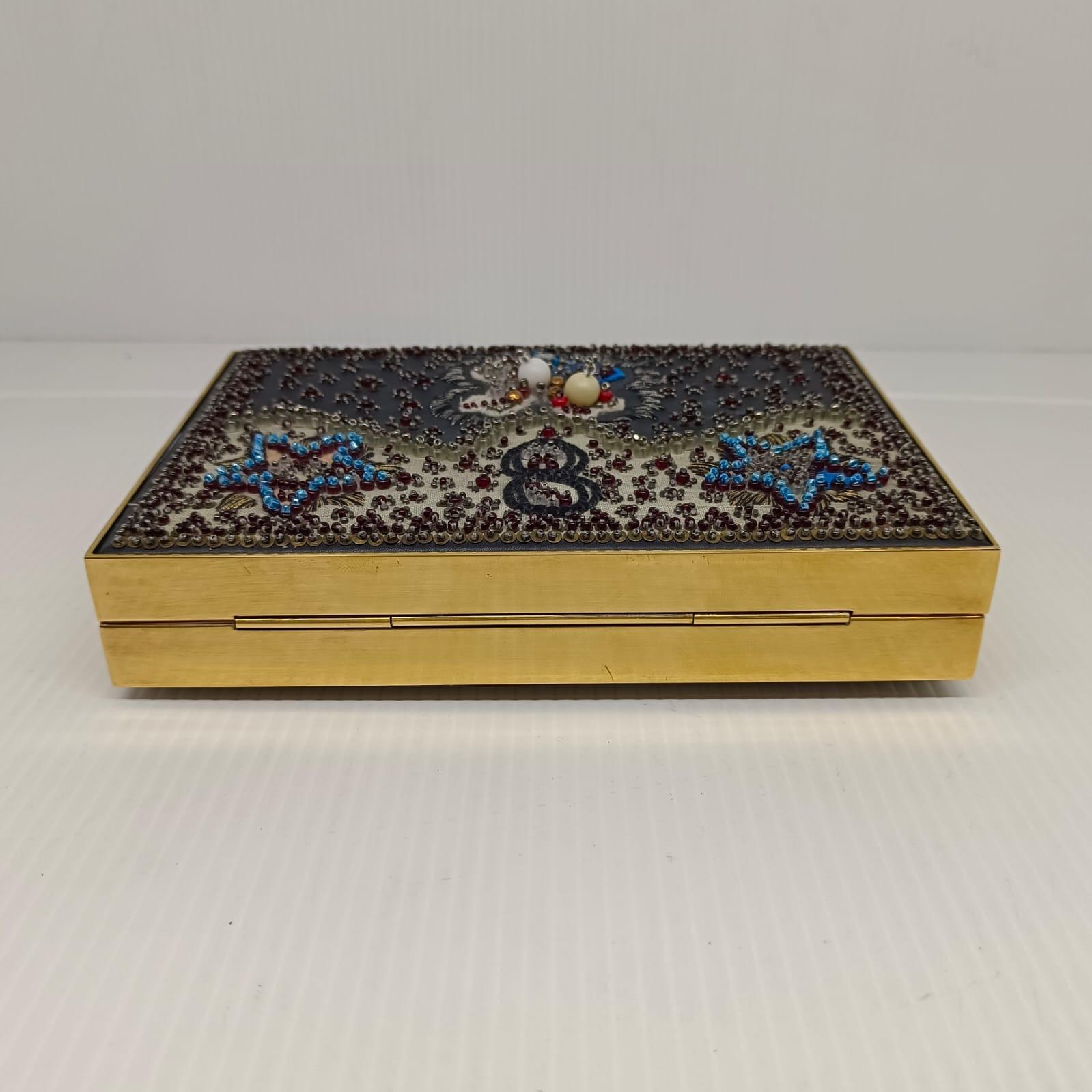 Beautiful Dior beaded evening clutch from cruise 2018 collection. Super intricate beading details. No broken beading whatsoever. Just minor pulled thread on the corners. Light tarnishing on the frame hardware. Comes with its CD engraved chain link