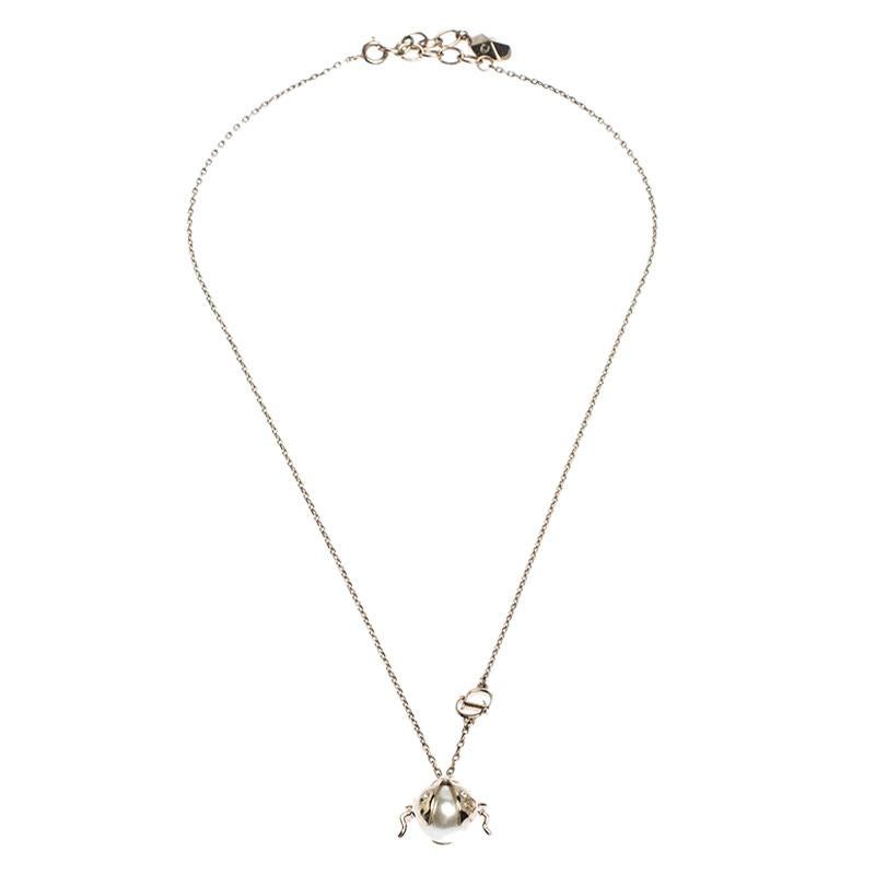 Simplicity is the ultimate sophistication and this pendant necklace from Dior aptly justifies that. The necklace is crafted from gold-tone metal and comes with a sleek chain and a beautiful pendant. The pendant features an embellished ladybug design