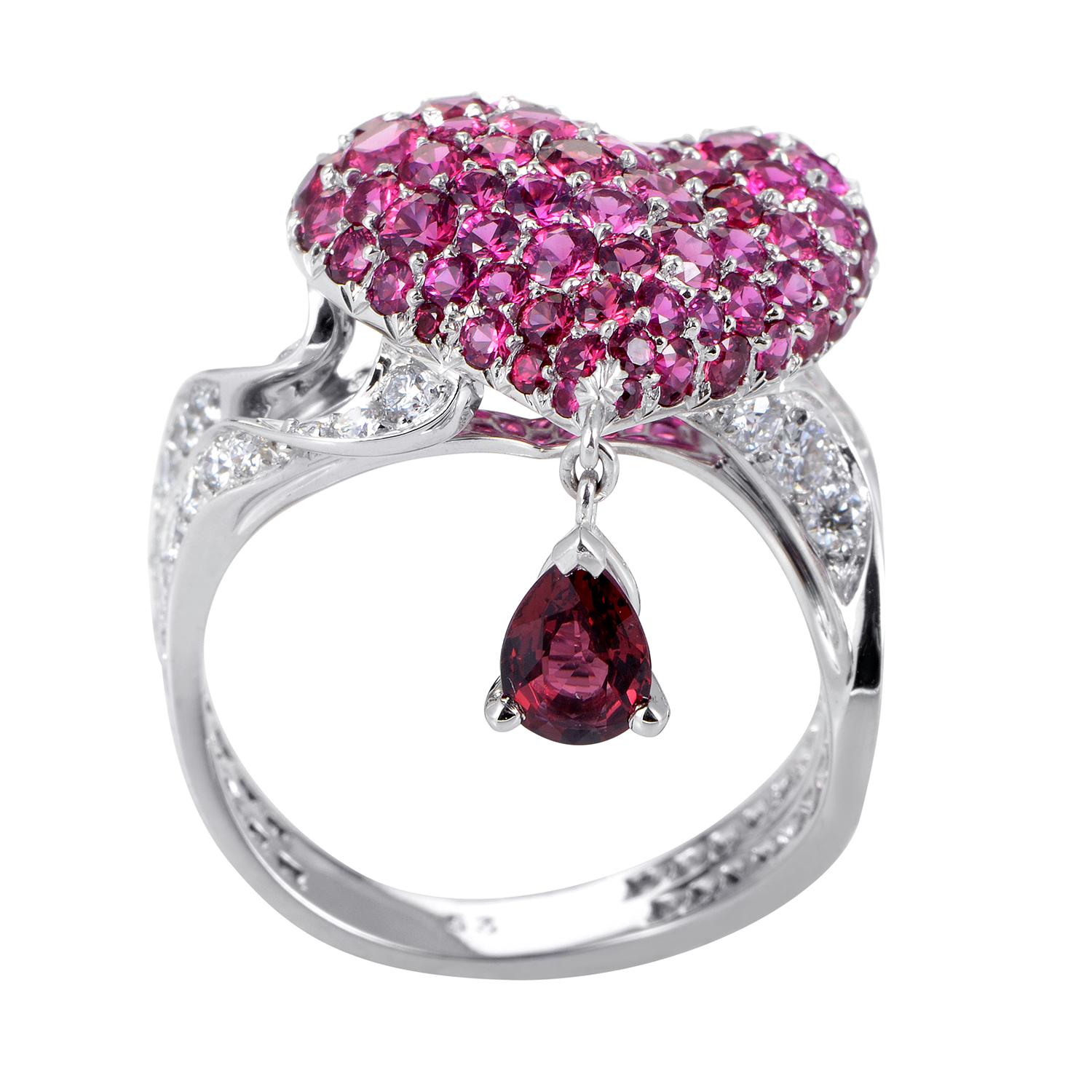 Gracefully entwined and embellished with glistening diamonds totaling 0.90ct, the wonderful body of this stunning 18K white gold ring from Dior leads up to the majestic heart motif adorned lavishly with precious rubies spinel <br />Ring Top