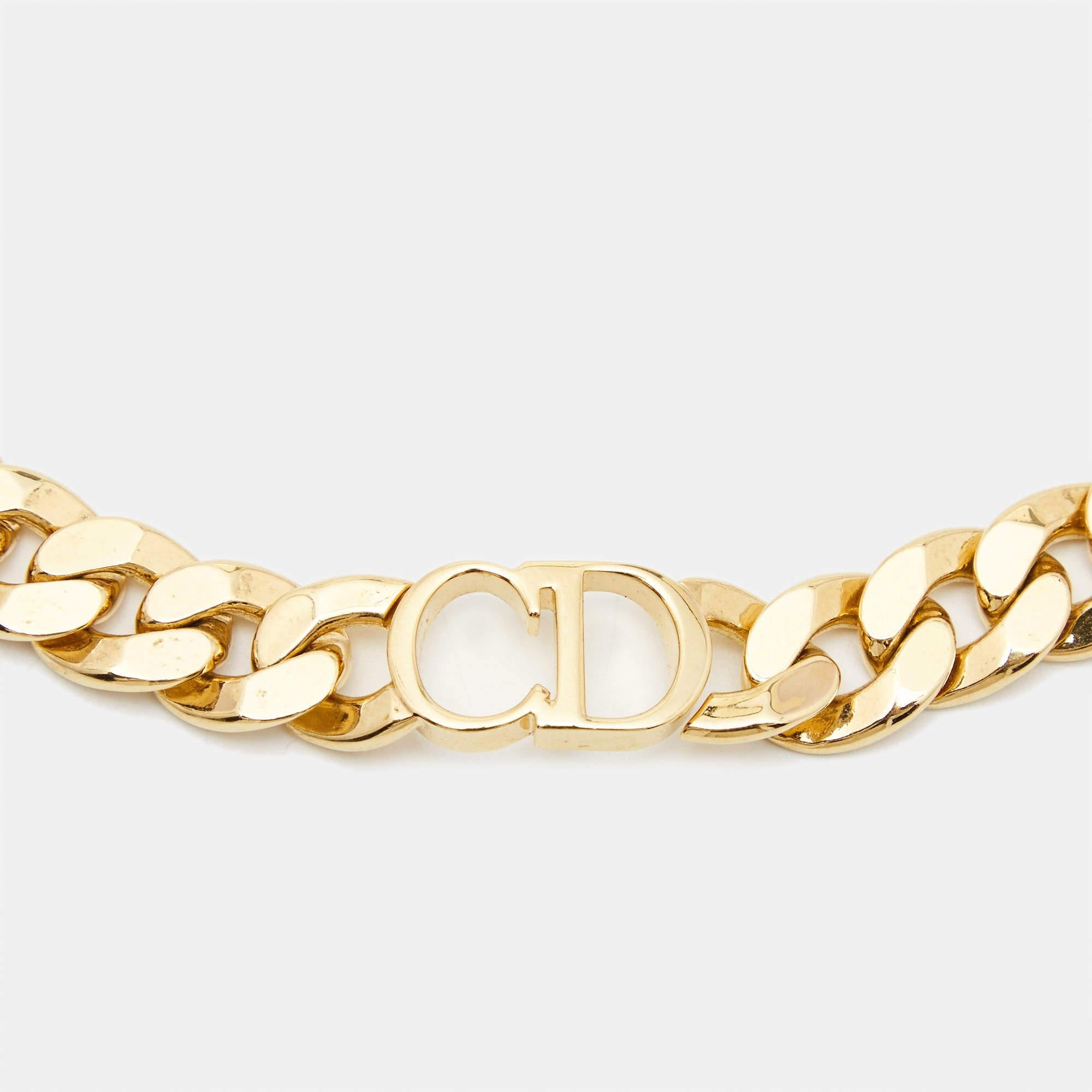 Add a statement finish to your outfit of the day with the Dior choker necklace. Created to be fashionable regardless of the season, the gold-tone metal necklace has a chain design and a CD logo center.

Includes: Original Dustbag, Original Invoice