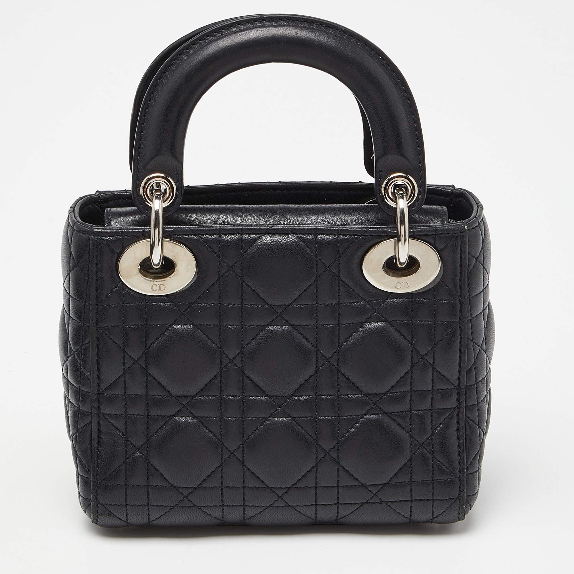 A timeless status and great design mark the Lady Dior tote. It is an iconic bag that people continue to invest in to this day. We have here this classic beauty crafted from Cannage leather. This mini Lady Dior is complete with two top handles, a