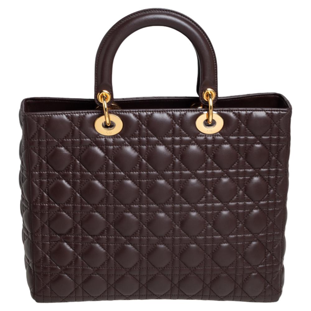 The Lady Dior tote is a Dior creation that has gained recognition worldwide and is today a coveted bag that every fashionista craves to possess. This brown tote has been crafted from leather and it carries the signature Cannage quilt. It is equipped
