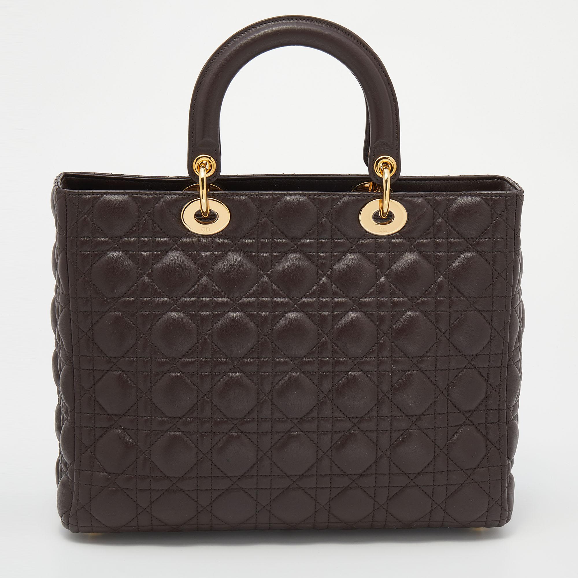 The Lady Dior tote is a Dior creation that has gained recognition worldwide and is today a coveted bag that every fashionista craves to possess. This dark brown tote has been crafted from leather and it carries the signature Cannage quilt. It is