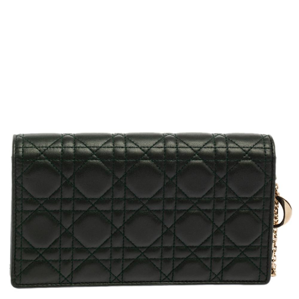A symbol of elegance and refinement, this Lady Dior will instantly elevate all your casual as well as evening ensemble. It is crafted from dark green leather and carries the signature Cannage quilt. It is equipped with a leather-lined interior and a