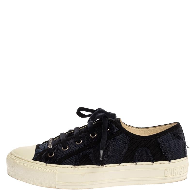 Let your latest shoe addition be this pair of much-coveted Walk'n'Dior low-top sneakers from Dior. They've been crafted from deep blue camo canvas and styled amazingly with lace-ups, the brand logo on the vamps, comfortable leather insoles, and