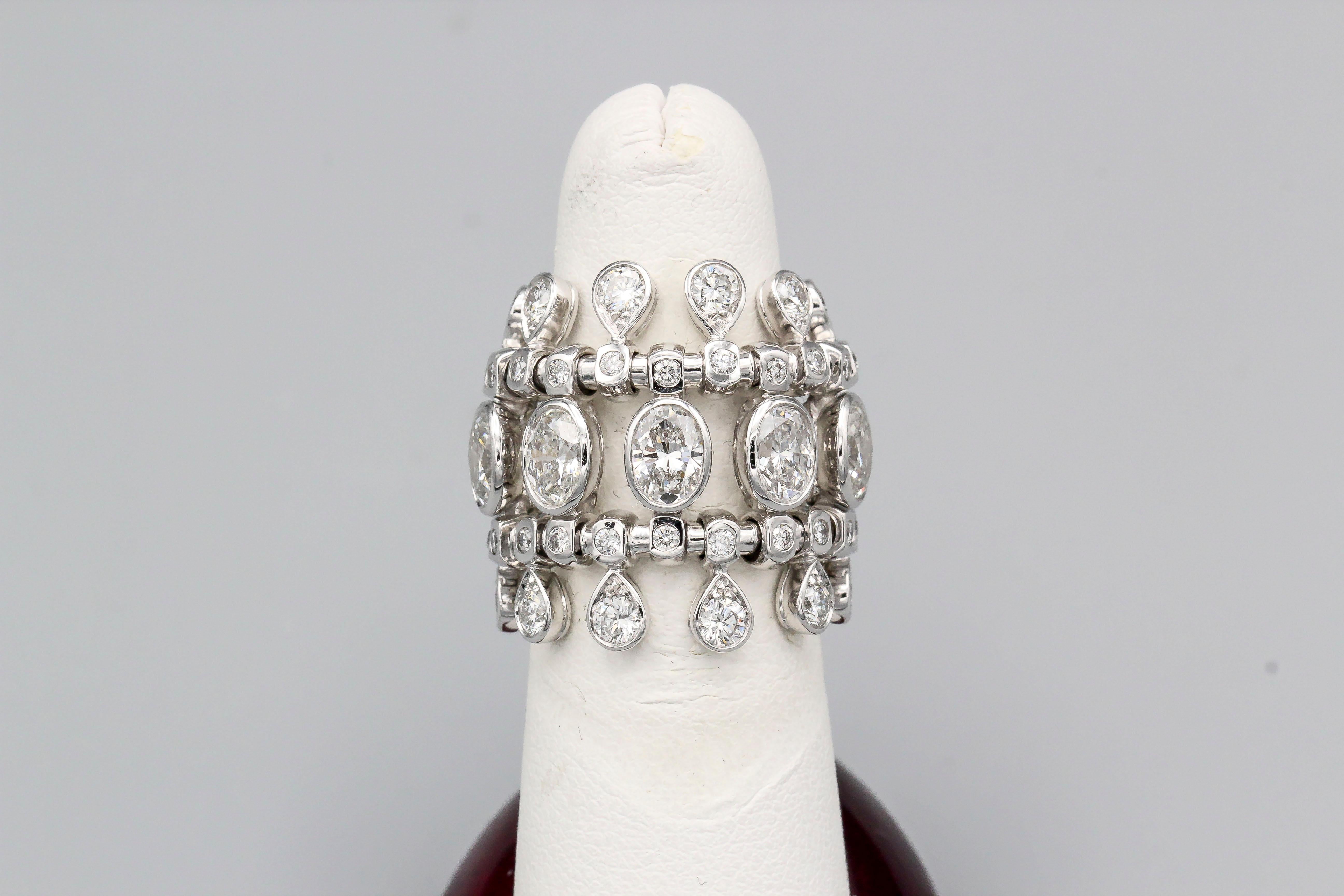 Elegant diamond and 18K white gold fringe ring by Dior. It features high grade oval and round brilliant cut diamonds, approx. 5.0-6.0cts total weight. European size 52, US size 6. Original retail price of $89,000.

Hallmarks: Dior 750, reference