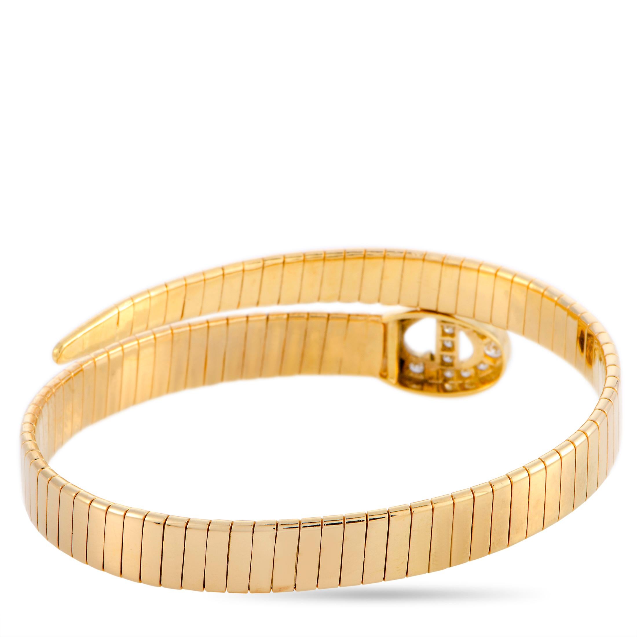 This Dior bracelet is made out of 18K yellow gold and diamonds and weighs 35.2 grams, measuring 7” in length with a 2.25” diameter.

The bracelet is offered in estate condition and includes the manufacturer’s box.