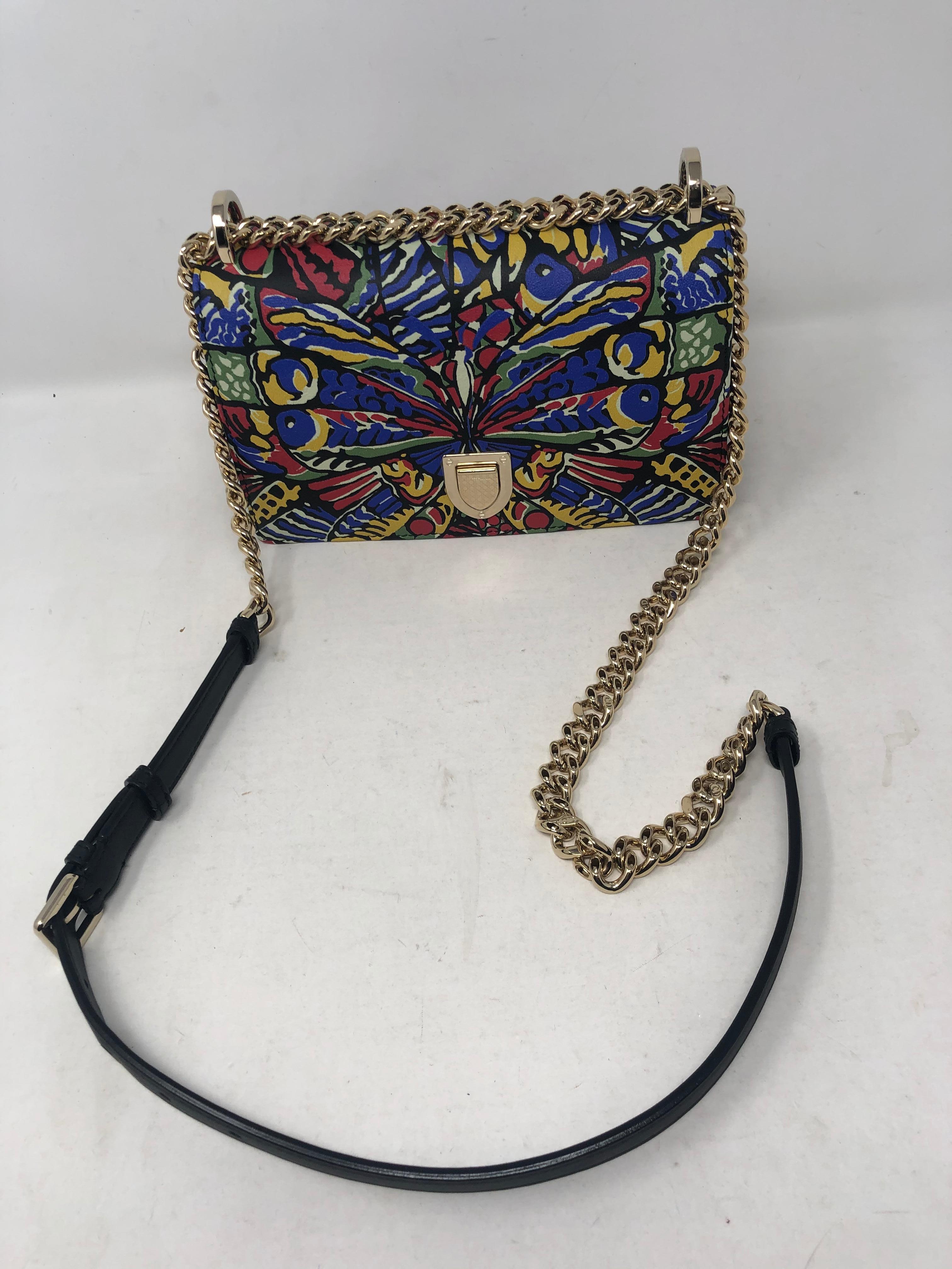 Diorama Butterfly Bag by Christian Dior. Beautiful Butterfly Design printed on leather bag. Gold Diorama hardware and gld tone chain strap with black leather. Can be worn as a crossbody or doubled. Rare and unique bag by Dior. Plenty of room inside