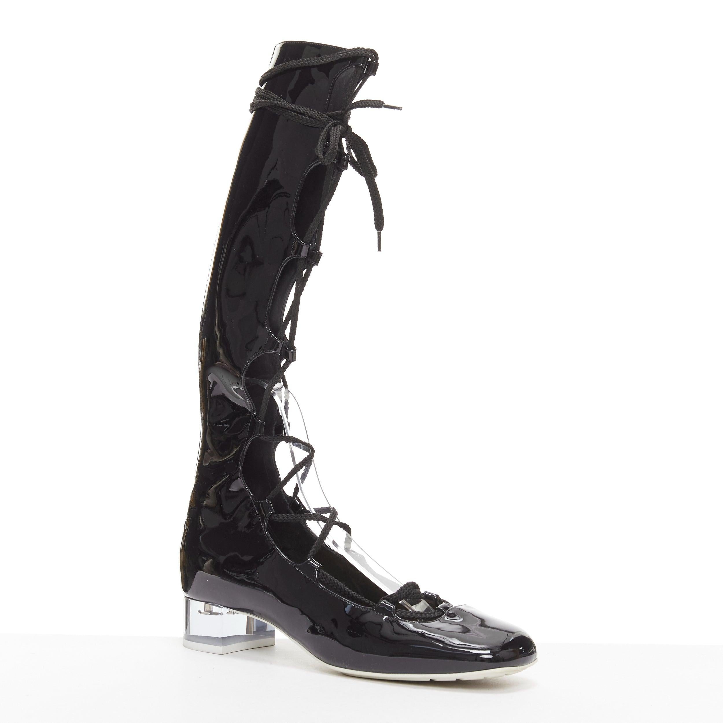 DIOR Diorarty silver star lucite heel black patent ballerina kitten heels EU38.5
Reference: AAWC/A00952
Brand: Dior
Model: Diorarty
Material: Leather
Color: Black, Clear
Pattern: Star
Closure: Zip
Lining: Black Leather
Extra Details: Lace up detail