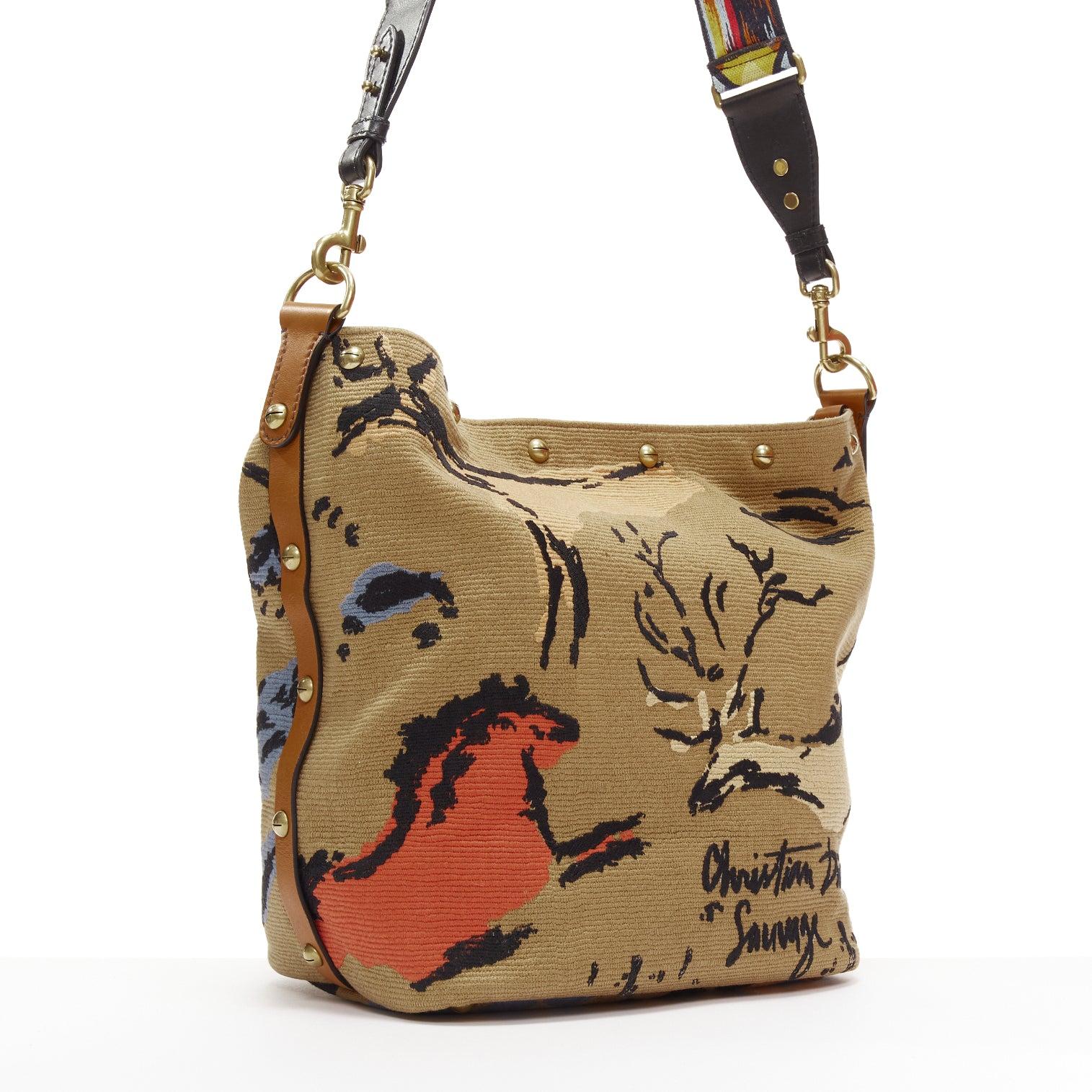 DIOR DiorAvenue Sauvage Special Edition brown logo canvas embroidery hobo bag
Reference: EALU/A00027
Brand: Dior
Designer: Maria Grazia Chiuri
Model: DiorAvenue Sauvage
Material: Fabric, Leather
Color: Brown, Multicolour
Pattern: Ethnic
Closure: