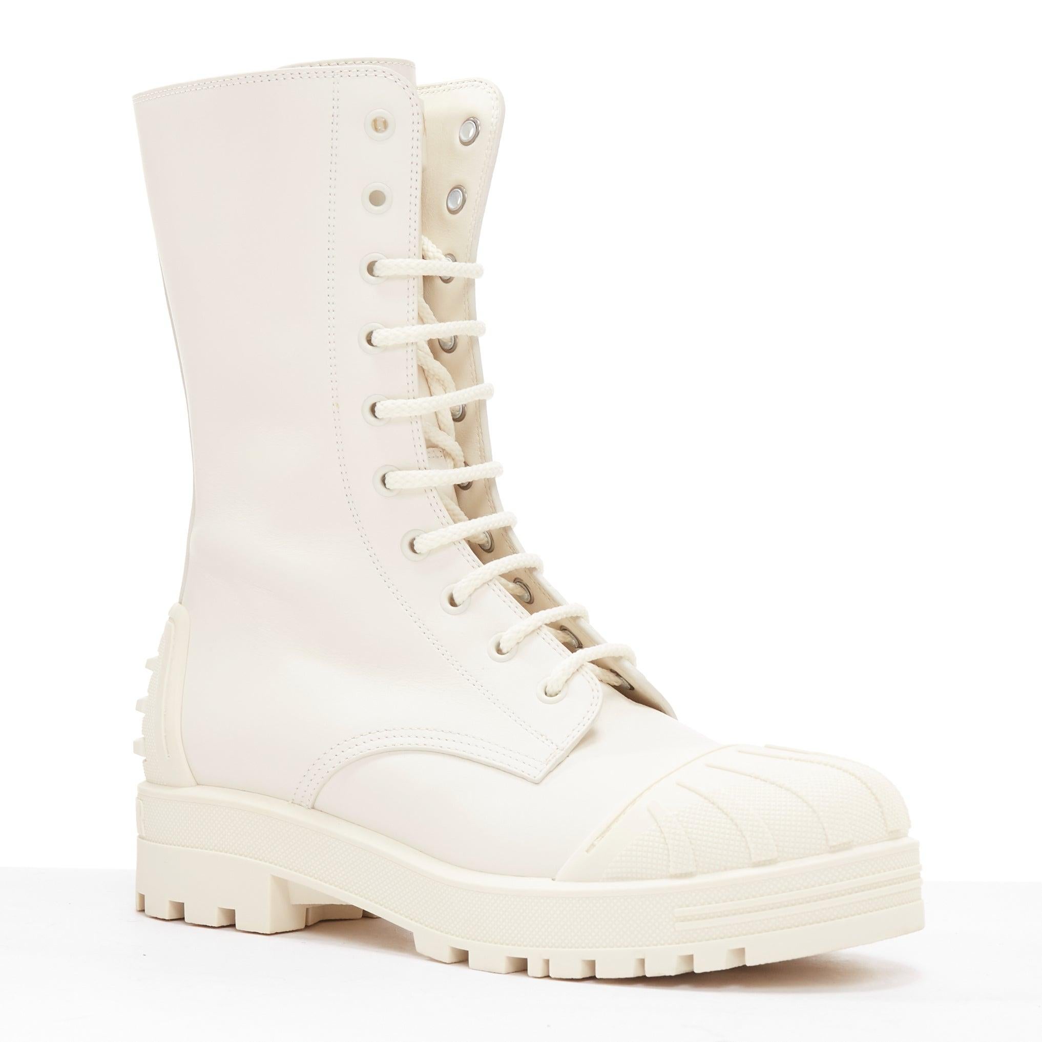 DIOR Dioriron cream CD logo back rubber cap combat boots EU38
Reference: LNKO/A02360
Brand: Dior
Model: Dioriron
Material: Leather, Rubber
Color: Cream
Pattern: Solid
Closure: Lace Up
Lining: Cream Leather
Extra Details: CHRISTIAN DIOR Calfskin