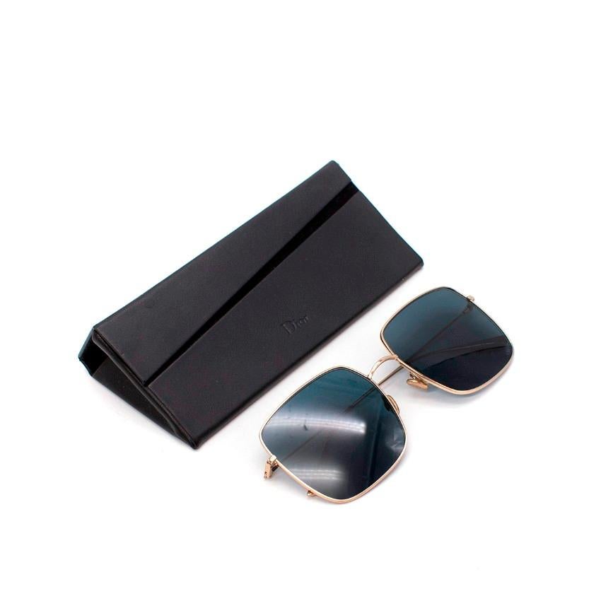 Dior DiorStellaire Square Gold-Tone Metal Sunglasses

- Oversized square shape 
- Slender gold-tone metal frames reminiscent of 1970s trends
- Fitted with dark blue-tinted lenses 
- Discreet DG logo engraving at the