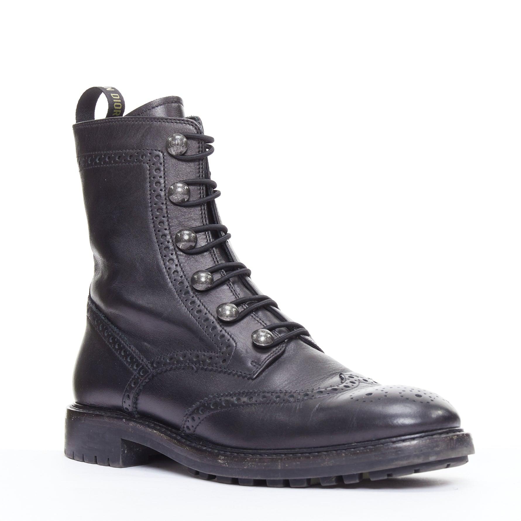 DIOR Diorunit black leather CD studs brogue combat boots EU38
Reference: NKLL/A00421
Brand: Dior
Designer: Maria Grazia Chiuri
Model: Diorunit
Material: Leather
Color: Black, Silver
Pattern: Solid
Closure: Elasticated
Lining: Black Leather
Extra