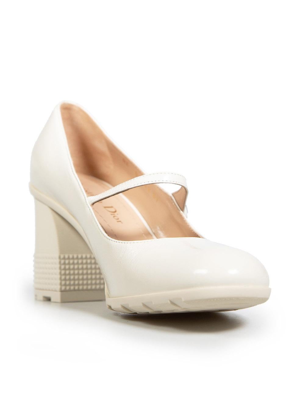 CONDITION is Never worn. No visible wear to heels is evident on this new Dior designer resale item. These heels include original dust bag.
  
  Details
  
  
  Model: D-doll
  
  Ecru 
  
  Patent leather 
  
  Pumps 
  
  Round-toe
  
  Button