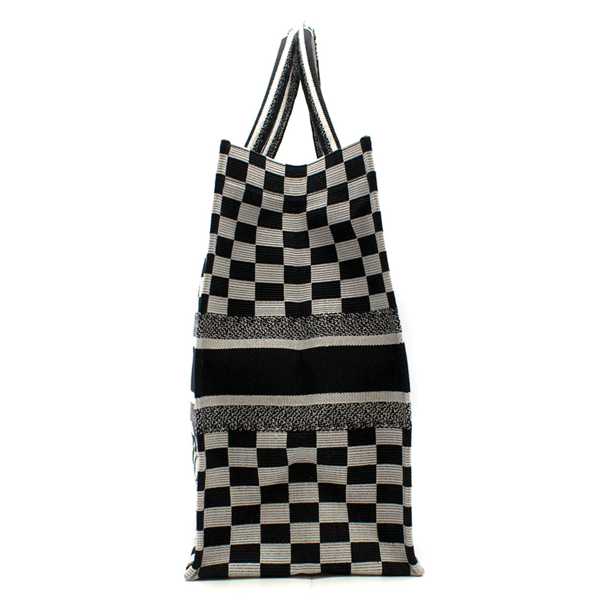 Dior Embroidered Canvas Book Tote Bag

- Black & white tote bag
- Gingham check embroidered canvas
- Lightweight
- Front 'Christian Dior Paris' embroidered
- Rolled top handles with 'Christian Dior' embroidered
- Internal large compartment
- This