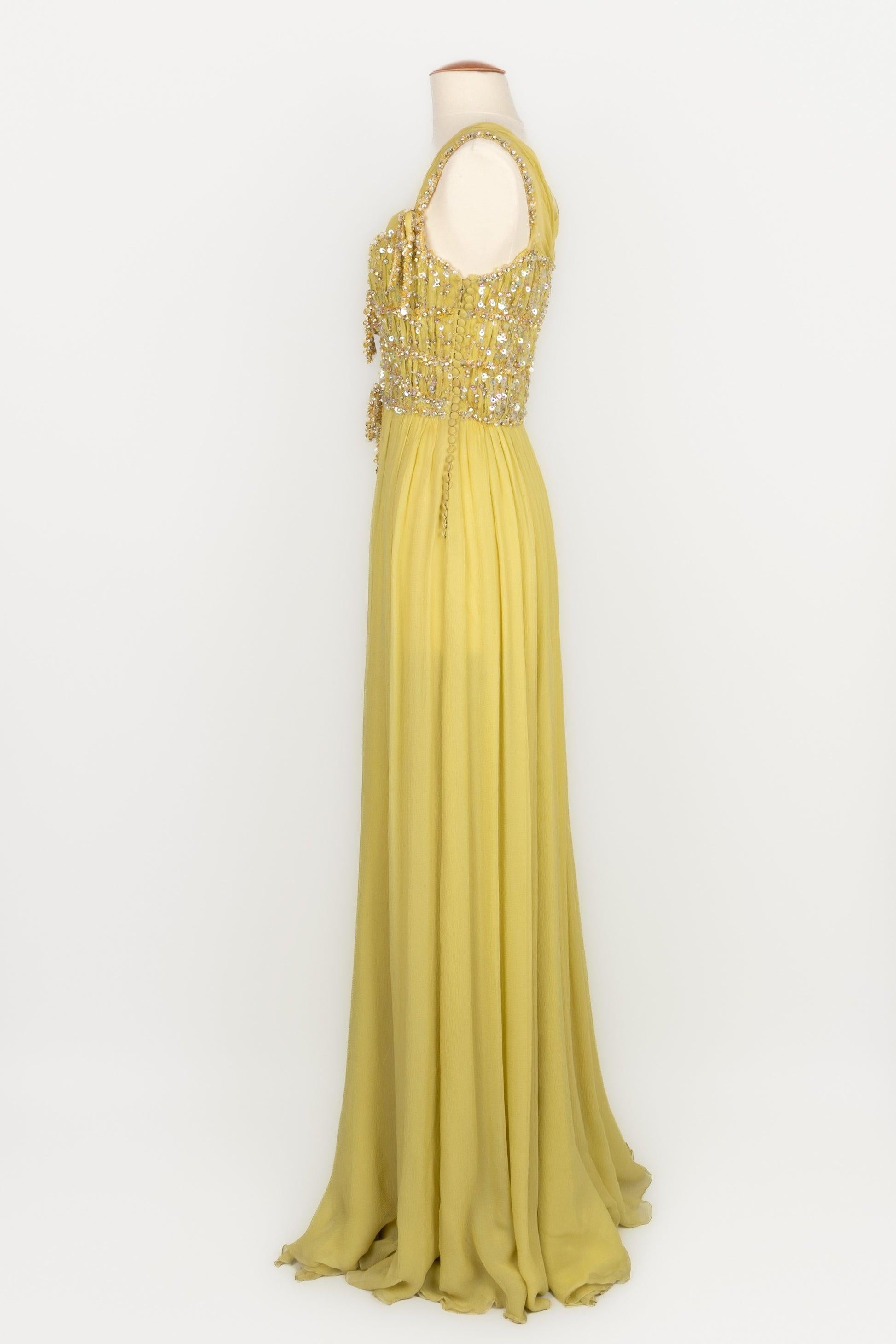 Dior - (Made in France) Long yellow silk muslin dress embroidered with pearls and sequins. Size 36FR. 2011 Resort Collection under the artistic direction of John Galliano.

Additional information:
Condition: Very good condition
Dimensions: Chest: 49