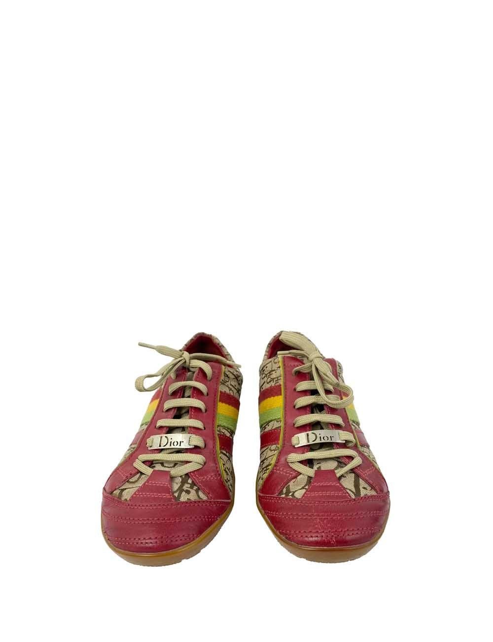Monogram print and red leather Dior sneakers. Red, yellow, and green stripes on the side with Dior-embossed plate on the front of the laces. Great condition barring some slight scuffing.

Additional information:
Material: Leather, Textile
Size: EU