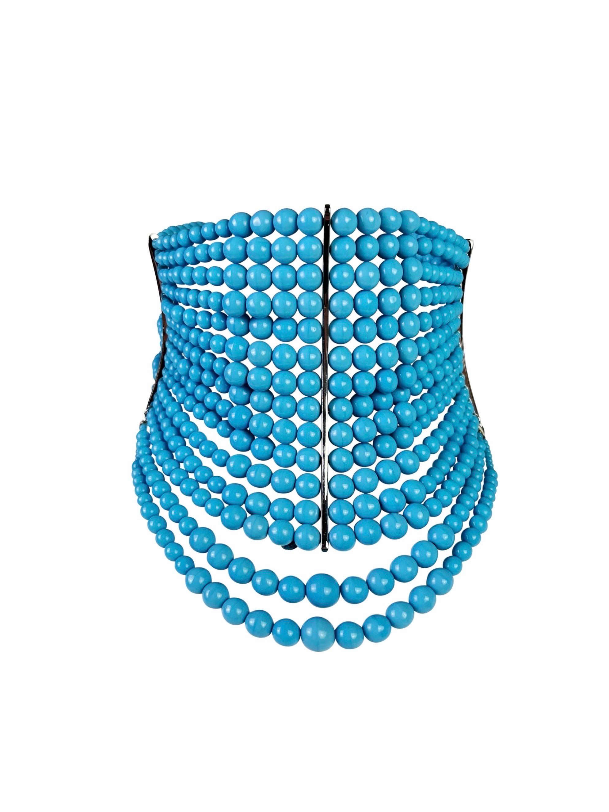 A truly iconic Dior Masai necklace in a stunning opaque blue glass and silver-toned hardware. A similar style was seen recently on Rihanna. 

Length - 32-38 cm (12,5-15 in)
Height - 10 cm (4 in)
Excellent vintage condition.