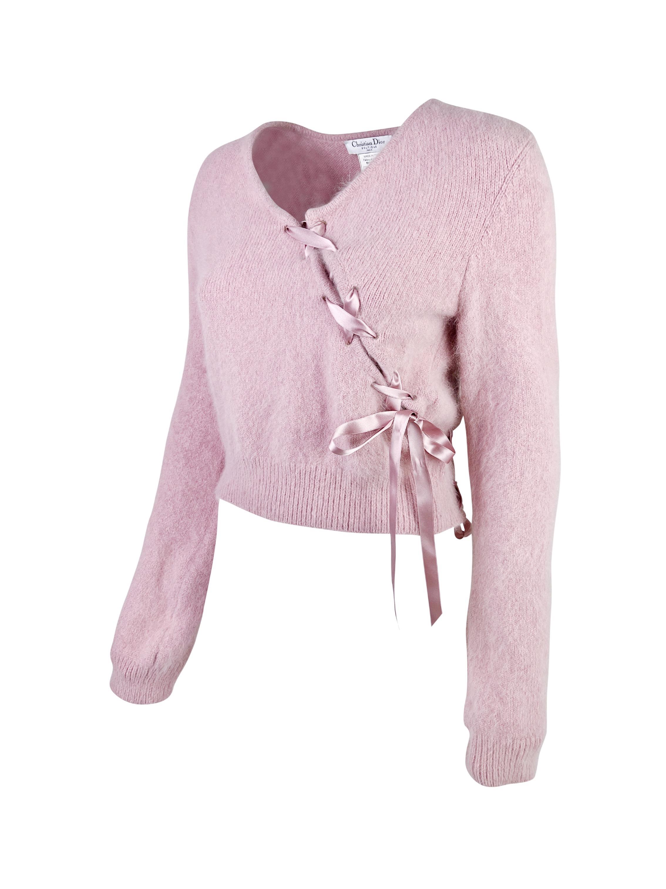 A beautiful and very fluffy angora sweater with stunning lace up details in the front and in the back decorated with silk ribbons.

Dirty rose/blush color (closer to the close-up photo of the label).

Size FR 38,  fits like Small, but can be styled