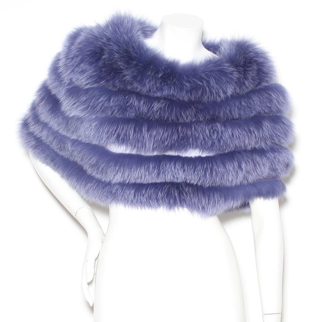 Product Details:
Fox fur capelet by Christian Dior 
Early/Mid 2000's 
Purple capelet
Sheer lining 
Layered fur 
Slip on
Made in France
Condition: Excellent, little to no visible wear (see photos)
Size/Measurements:
Size small 
34