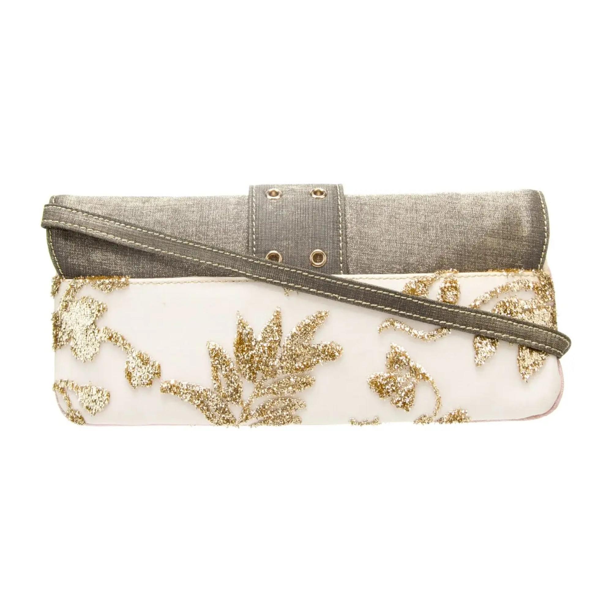 This bag is constructed of pink canvas with neutral leather finishes, featuring gold decorative embroidery and perforated leather details—a signature element from the Galliano Street Chic collection. The flap is secured with a classic buckle closure