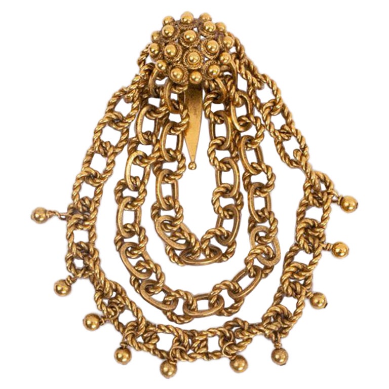 Broche de metal dorado Dior