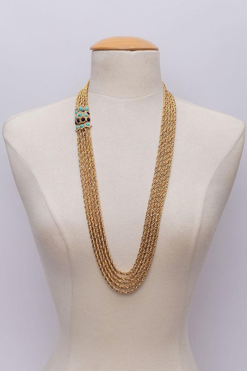 Dior (Made in Germany) Gilted metal multi-chains necklace with its jewel clasp paved with blue cabochons. 
1969 collection.

Additional information: 

Dimensions: 
Length: 80 cm (31.5 in) 

Condition: 
Very good condition
Seller Ref number: BC74
