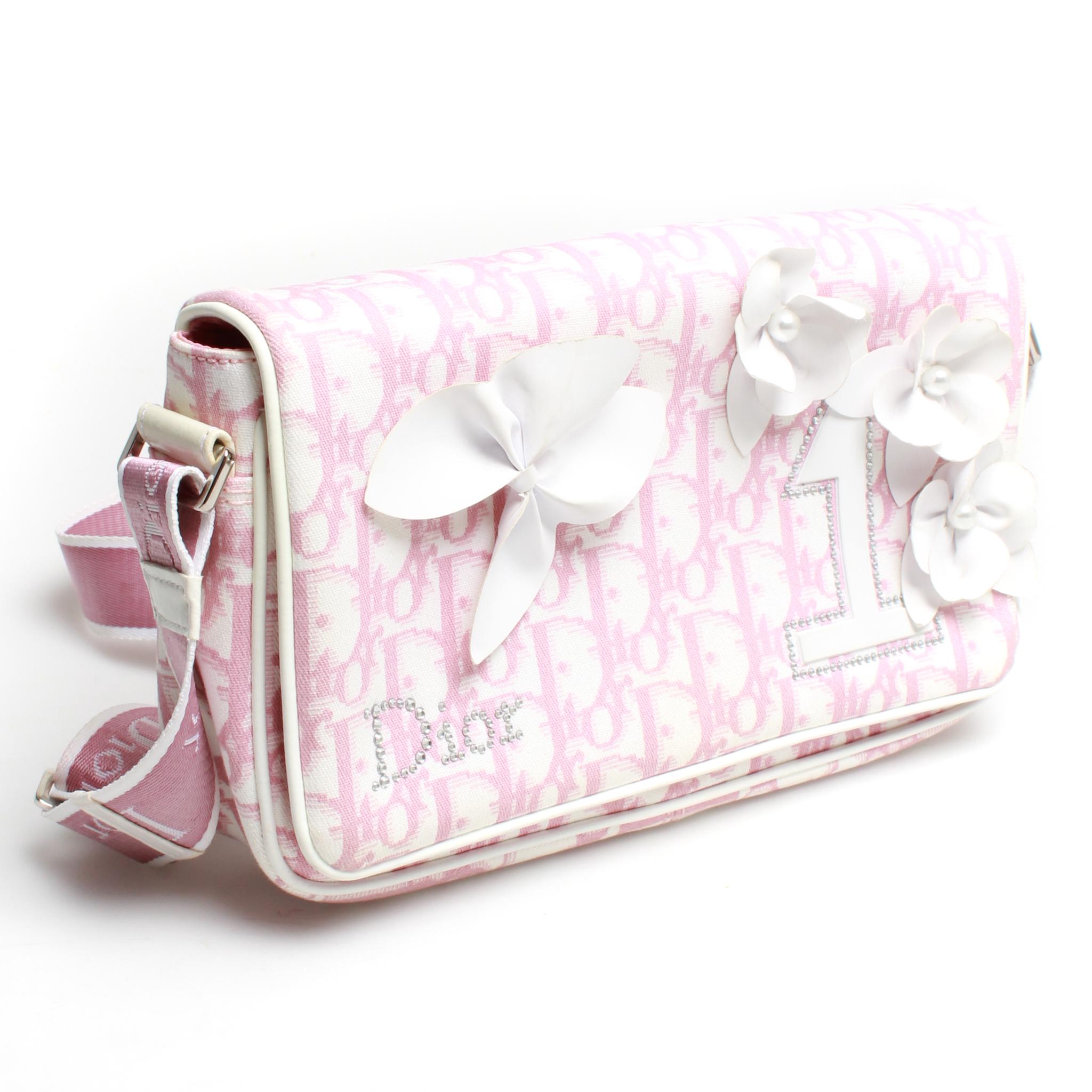Darling pink and white Diorissimo canvas Christian Dior Girly Reporter cross body bag with front flap and magnetic closure, silver-tone hardware, long adjustable shoulder strap, gorgeous white leather trim, crystal embellishments and floral appliqué