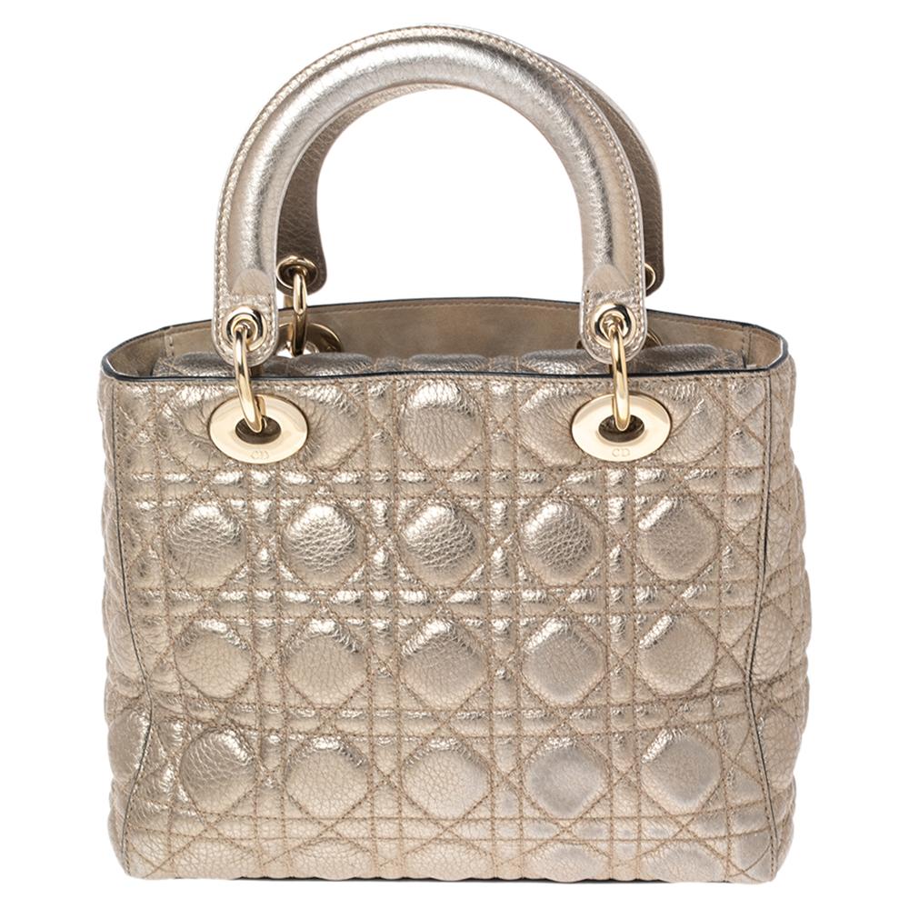 The Lady Dior tote is a Dior creation that has gained recognition worldwide and is today a coveted bag that every fashionista craves to possess. This gold-hued tote has been crafted from leather and it carries the signature Cannage quilt. It is