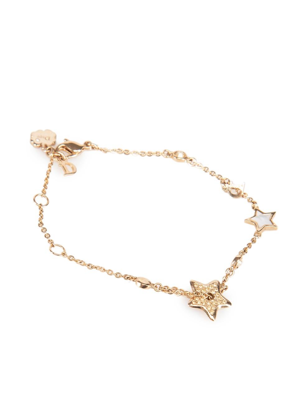 CONDITION is Very good. Minimal wear to bracelet is evident. Minimal wear to the charms with very light scratches on this used Dior designer resale item. This item comes with original box.

Details
Gold
Metal
Charm bracelet
Lobster