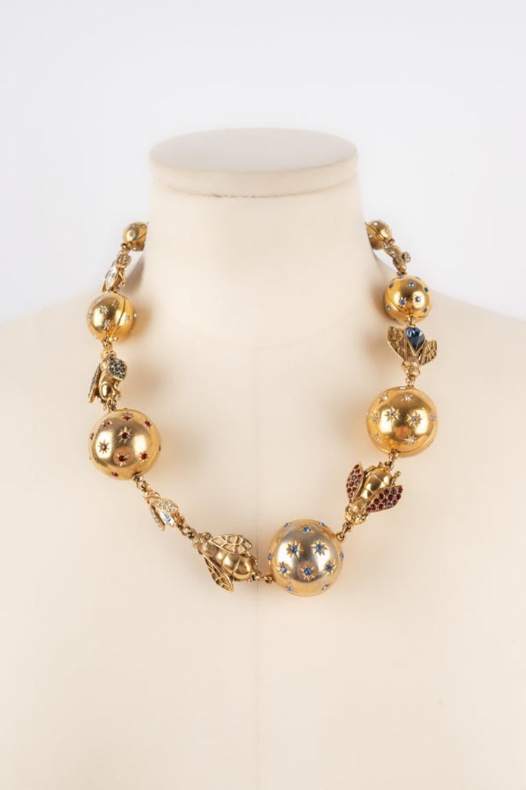 Dior - (Made in France) Golden metal necklace with rhinestones representing bees. Jewelry from the 1990s.

Additional information: 
Condition: Good condition
Dimensions: Length: 54 cm
Period: 20th Century

Seller Reference: BC190