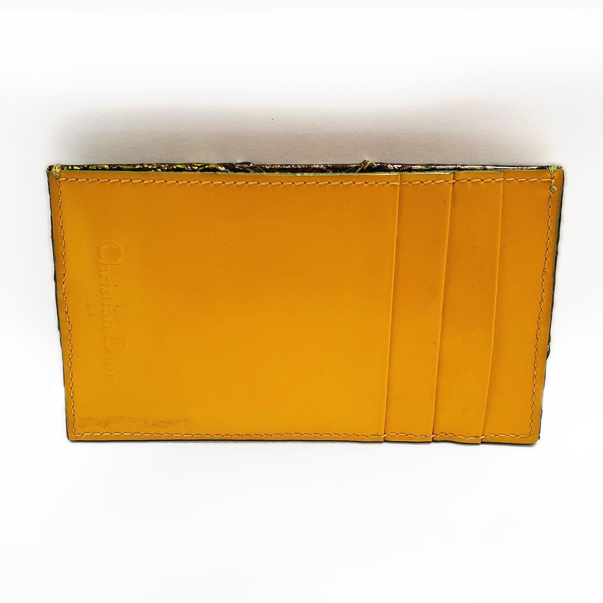 Brand - Dior
Style - Card Holder
Material - Leather
Color - Green and Yellow
Feature - Wallet
Bag Depth - 0.2 in
Bag Width - 4.5 in
Bag Height - 2.75 in

The House of Dior was founded in December 1946 in Paris by Christian Dior. However, Dior