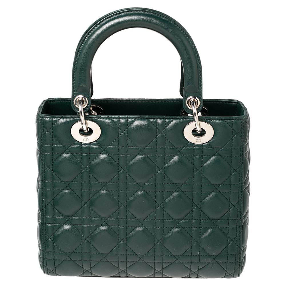 The Lady Dior tote is a Dior creation that has gained recognition worldwide and is today a coveted bag that every fashionista craves to possess. This green tote has been crafted from leather and it carries the signature Cannage quilt. It is equipped