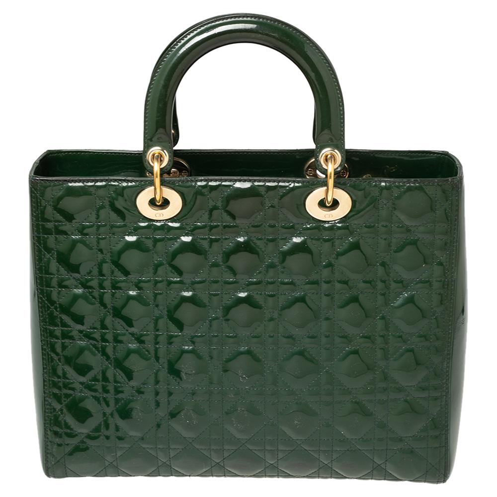 A timeless status and great design mark the Lady Dior tote. It is an iconic bag that people continue to invest into this day. We have here this classic beauty crafted from green patent leather. The bag has a lined interior for your essentials. This