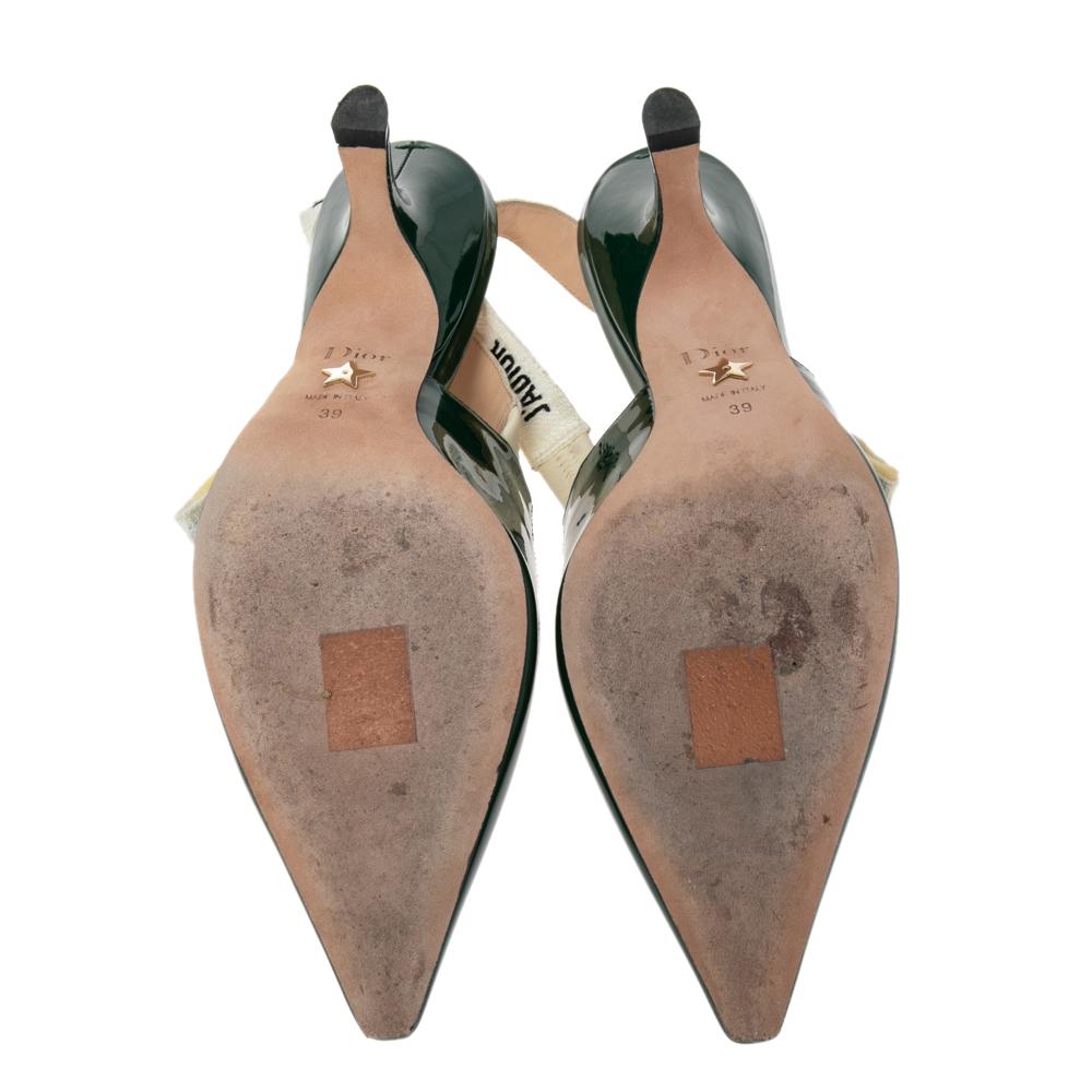 You'll definitely receive compliments wherever you go when you step out in these lovely pumps from Dior. The green pumps are crafted from patent leather and feature pointed toes. They flaunt 'J'adior' ribbons and come equipped with comfortable