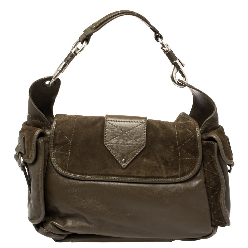 Incorporate a touch of sophistication to your everyday looks with this inviting Rebelle hobo. It is crafted from suede & leather and features a slouchy silhouette enhanced by flap pockets to the sides, buckles trims, and perceptible stitching