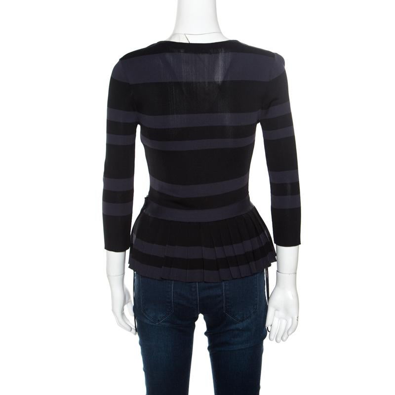 Look your casual best in this peplum top by Dior. Featuring classic muted hues, this top is adorned with a striped pattern all over. The tapered waist makes for a very flattering silhouette as you head out for a casual day out.

Includes: The Luxury