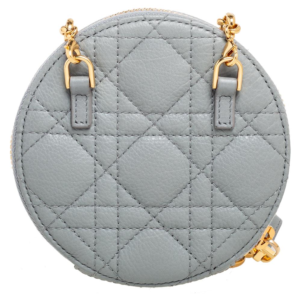 The Dior Caro bag is a testimony to the timeless and intrinsically modern aesthetics of the brand. Named after Christian Dior's sister Catherine, the bag celebrates the woman of today. This Caro round pouch has been crafted from grey leather and